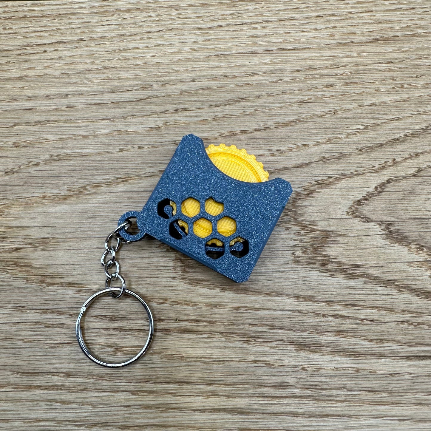 Stressspielzeug "Fidget Wheel" - Schlüsselanhänger mit Drehrad zum Stress reduzieren und rumspielen- Grau/Orange