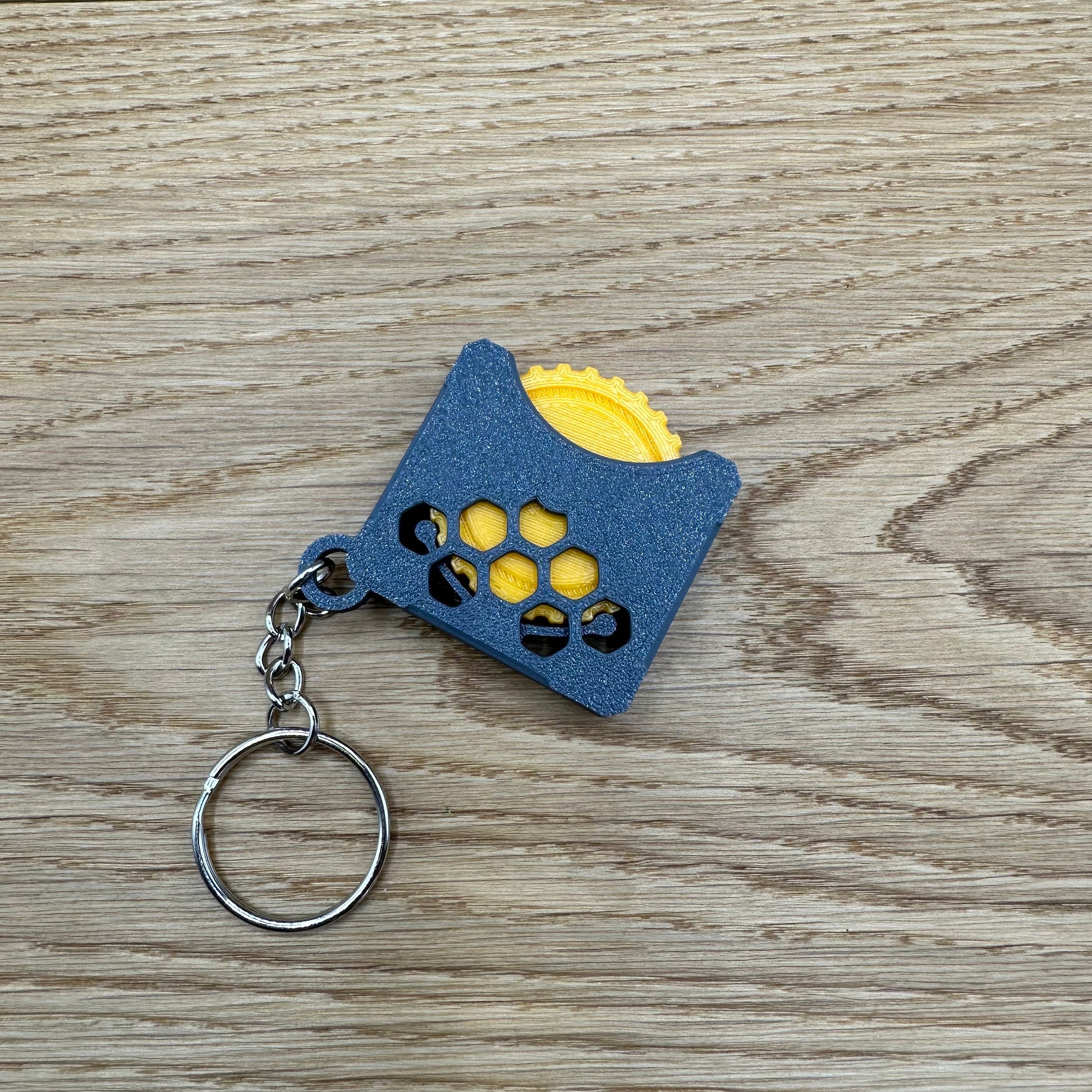 Stressspielzeug "Fidget Wheel" - Schlüsselanhänger mit Drehrad zum Stress reduzieren und rumspielen- Grau/Orange